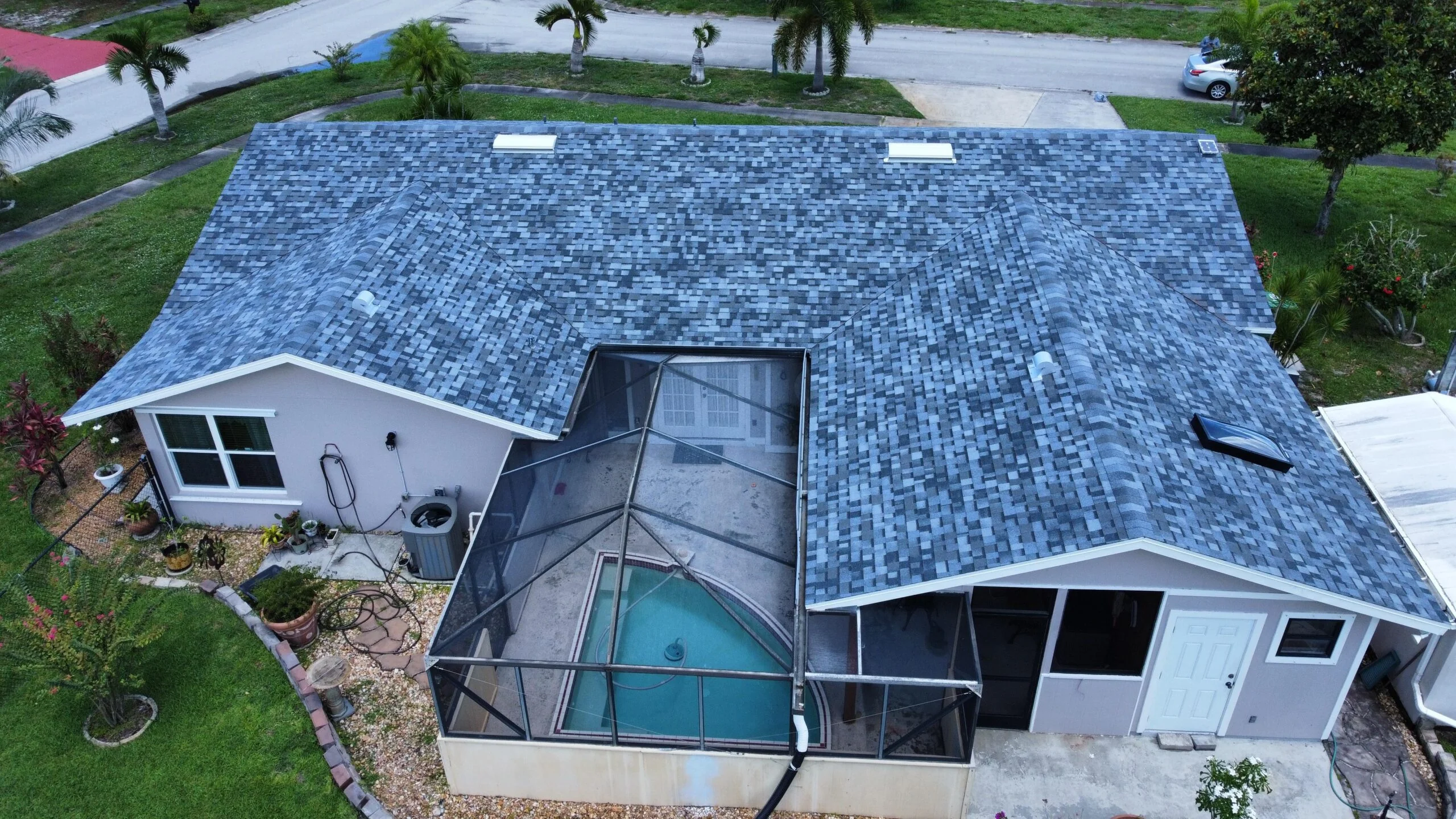 Aerial view of completed shingle roof replacement in Broward County FL by Qualitech Roofing